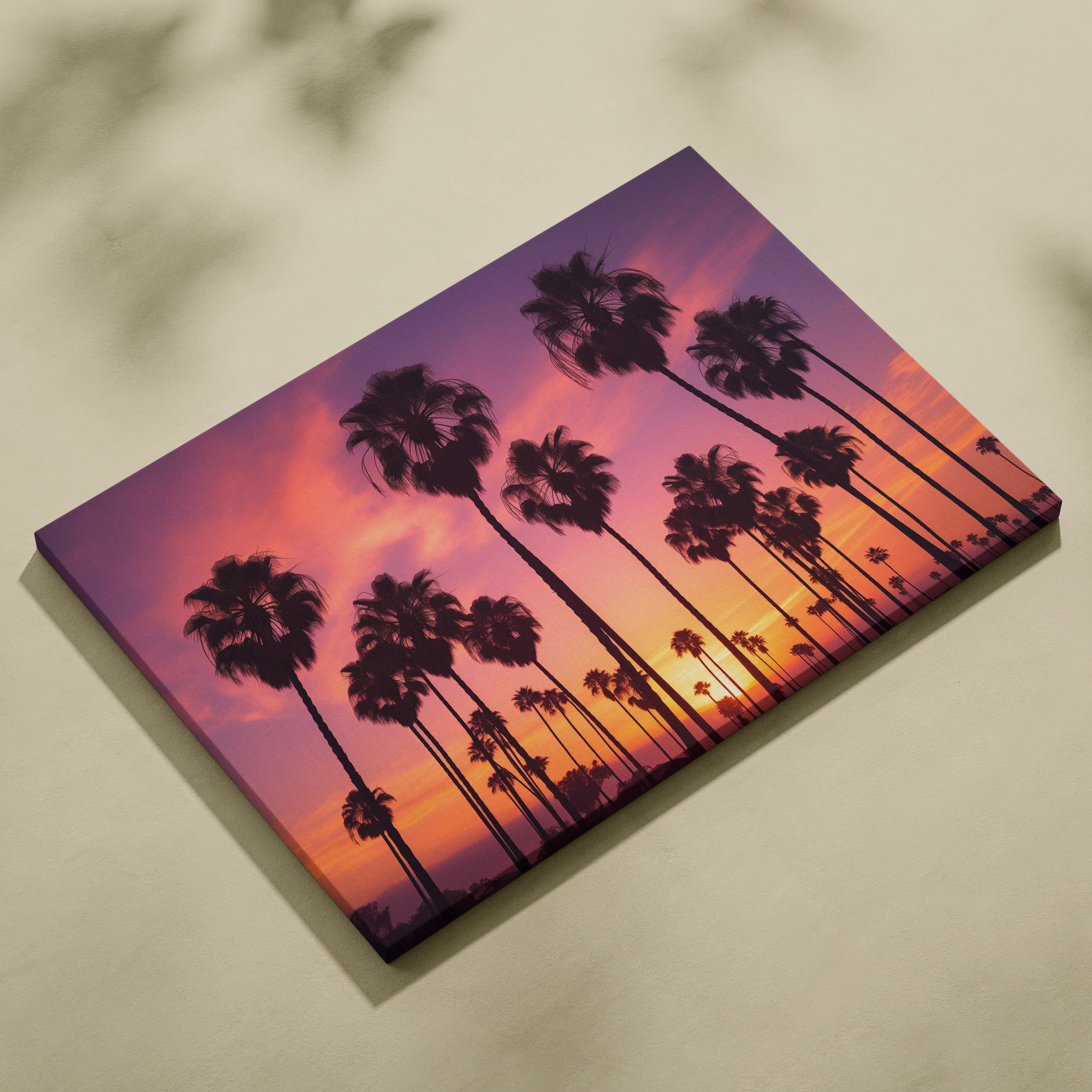Canvas wall art featuring black palm tree silhouettes against a vibrant purple and orange tropical sunset sky.