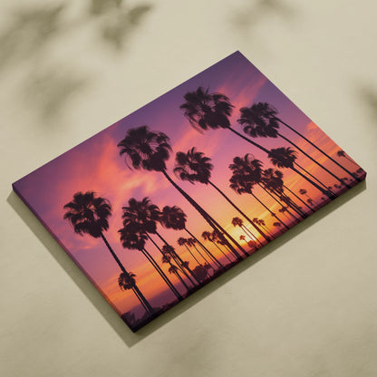 Canvas wall art featuring black palm tree silhouettes against a vibrant purple and orange tropical sunset sky.