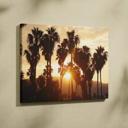 Tropical sunset palm trees silhouette canvas wall art with warm orange and yellow tones for living room decor.