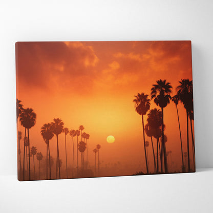 Canvas wall art featuring digital art of palm tree silhouettes against a vibrant orange sunset sky.