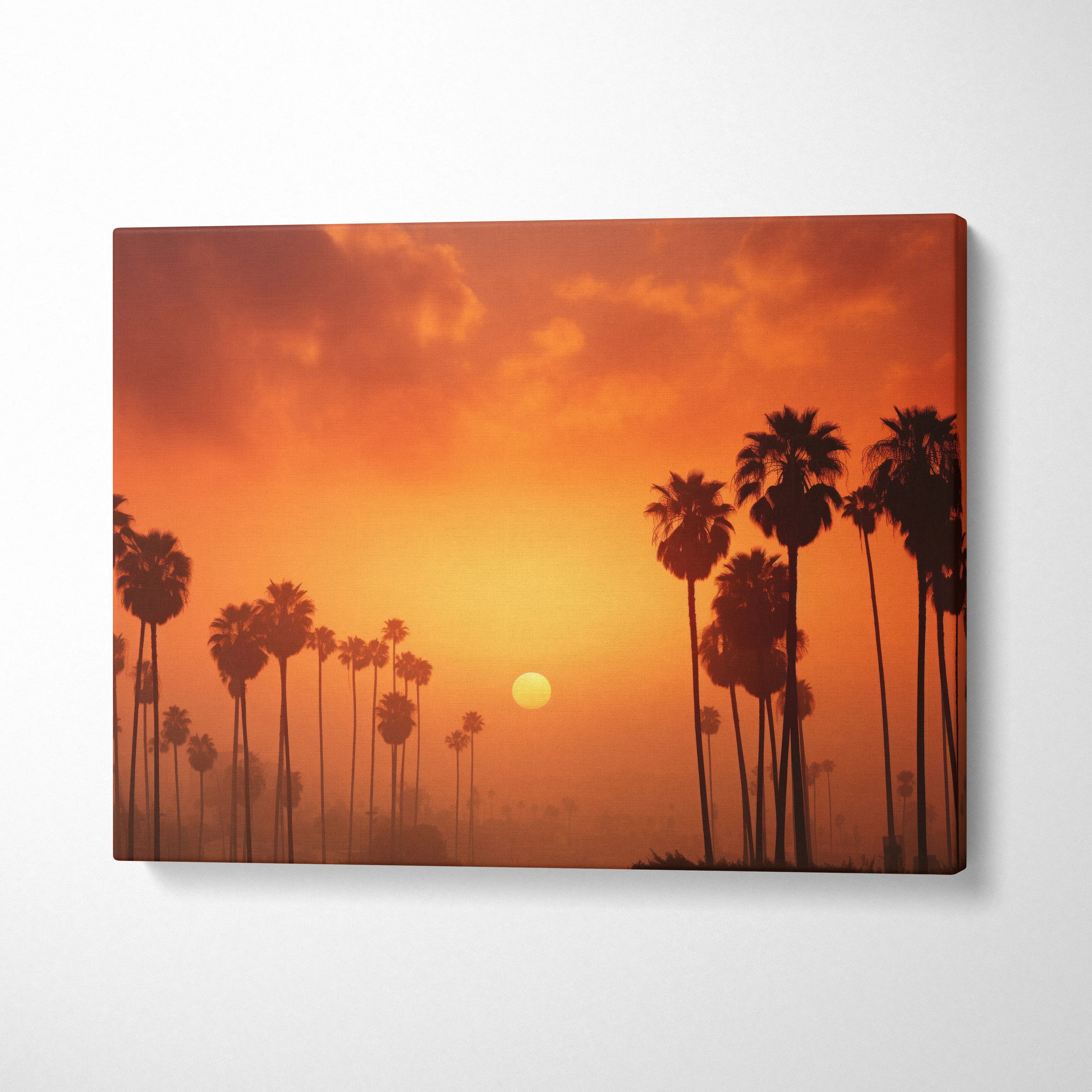 Tropical palm trees silhouette at sunset on vibrant orange canvas wall art decor.
