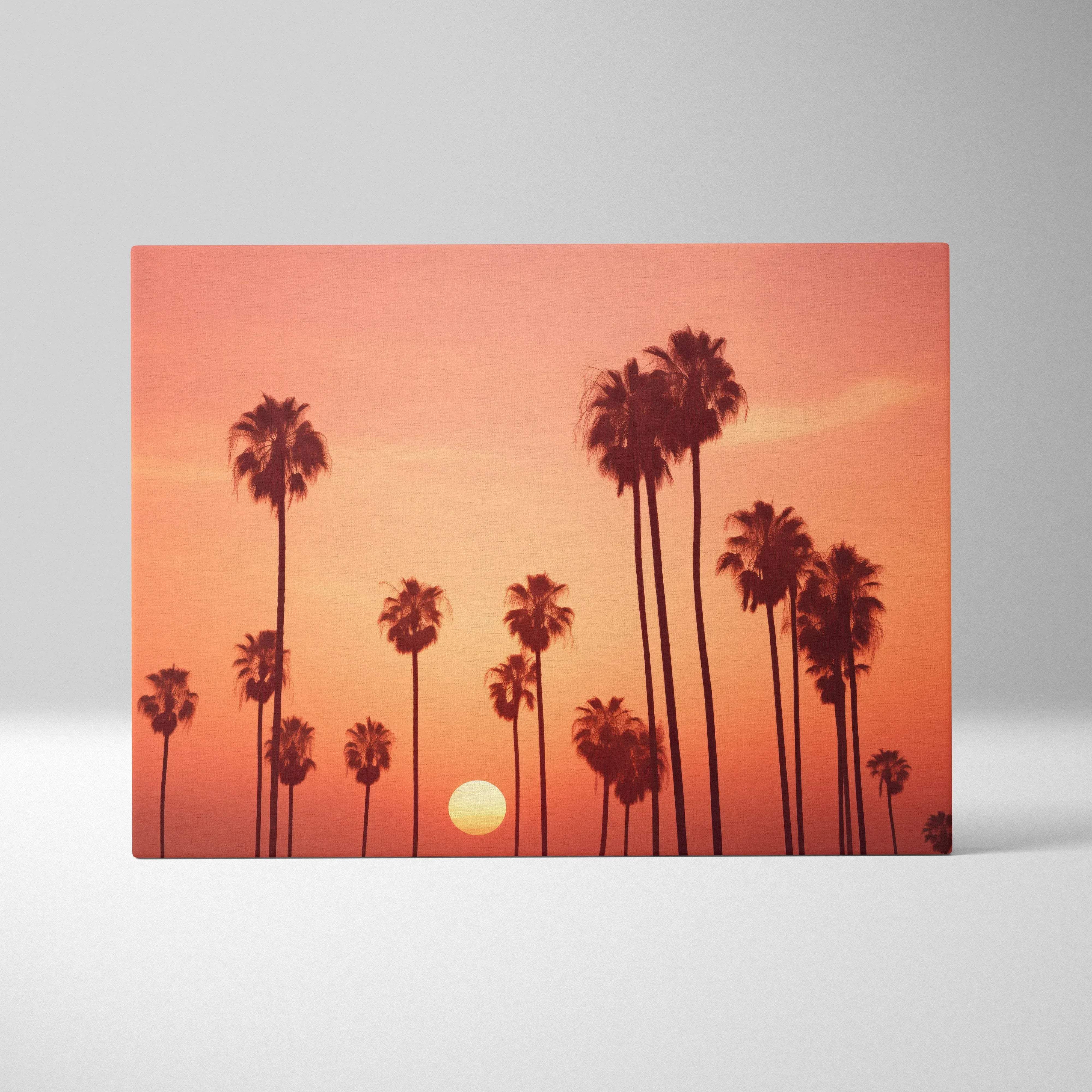 Rectangular canvas wall art featuring silhouetted palm trees against a vibrant orange sunset for coastal decor