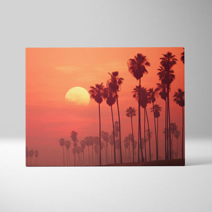 Tropical sunset silhouette of tall palm trees on canvas wall art with warm orange and red tones.