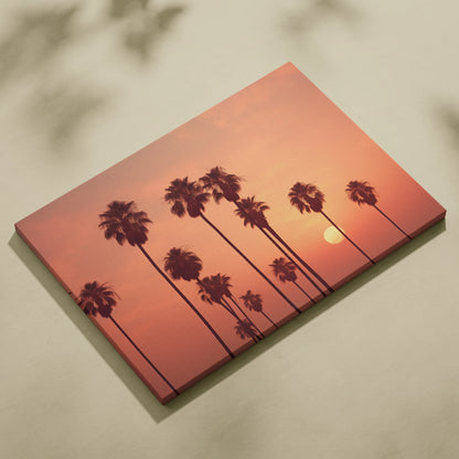 Tropical palm trees silhouette against orange sunset sky canvas wall art decor.
