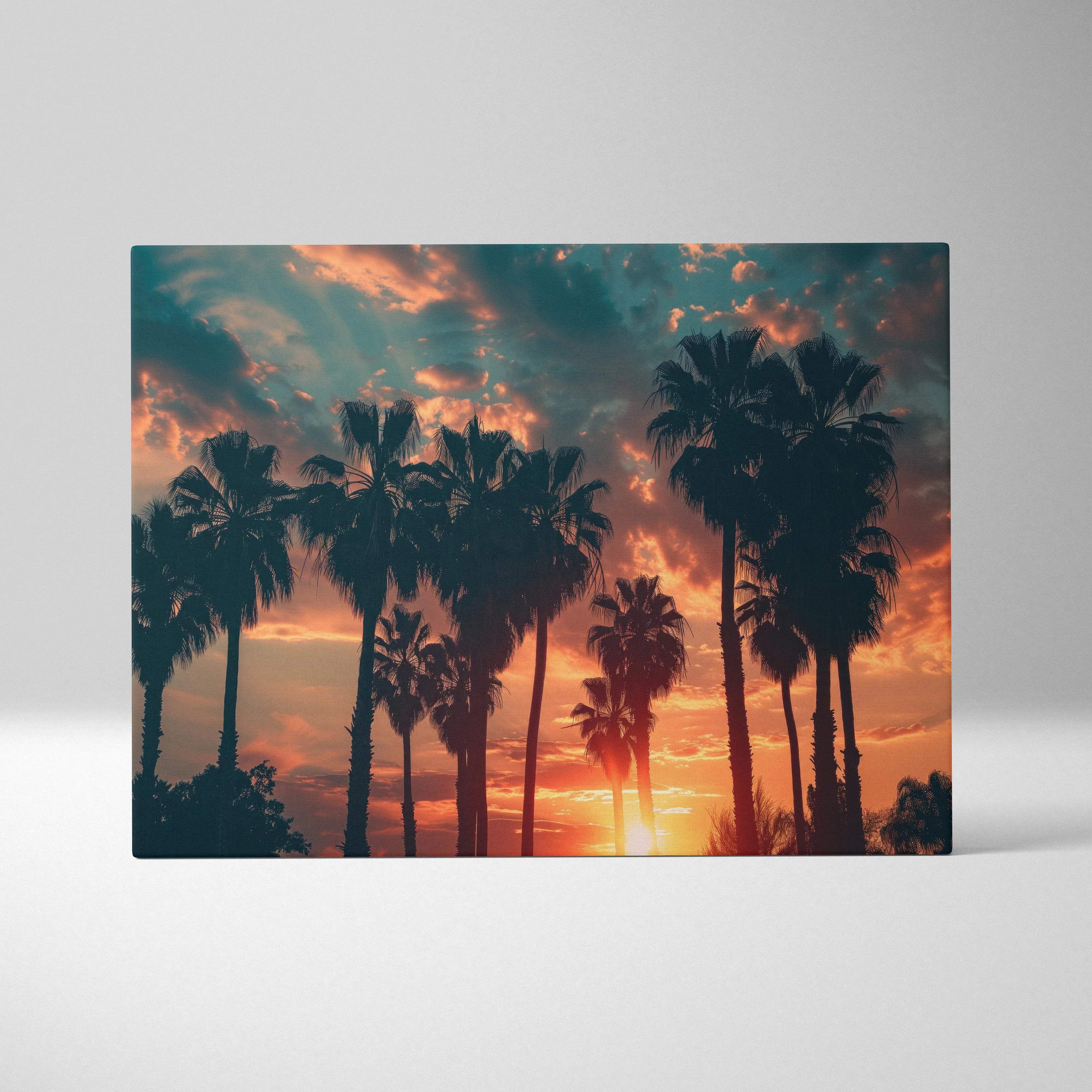 Rectangular canvas wall art featuring silhouetted palm trees against a vibrant orange pink and teal tropical sunset sky