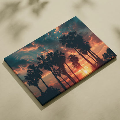 Canvas wall art featuring black palm tree silhouettes against a vibrant orange and blue tropical sunset sky.