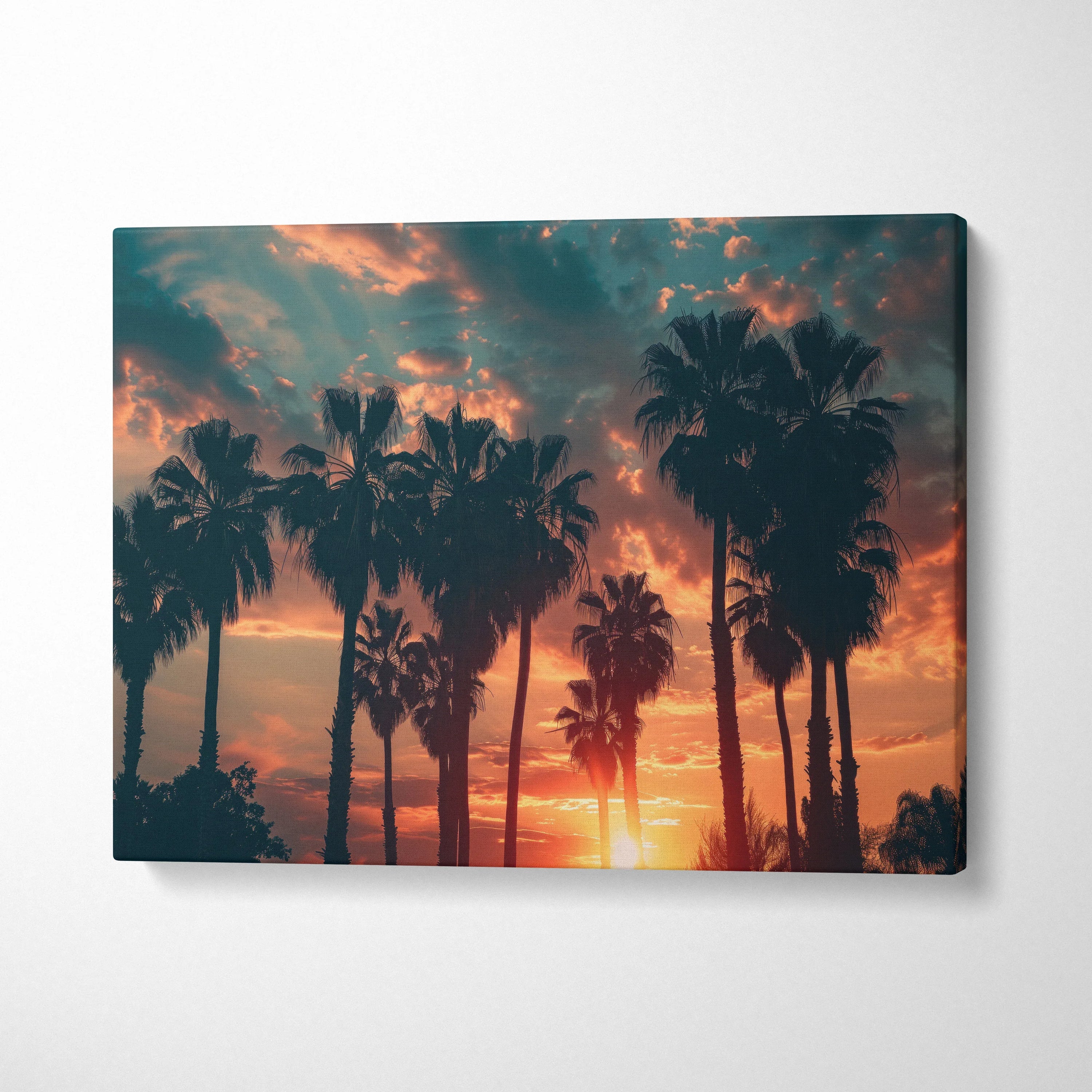 Canvas wall art featuring a tropical sunset with palm tree silhouettes against an orange and blue sky.