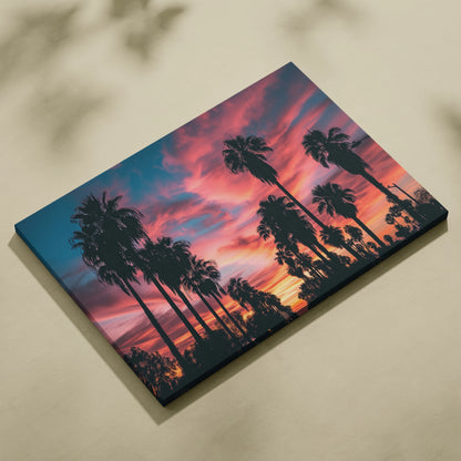 Canvas wall art featuring tall black palm tree silhouettes against a warm orange and pink tropical sunset sky.