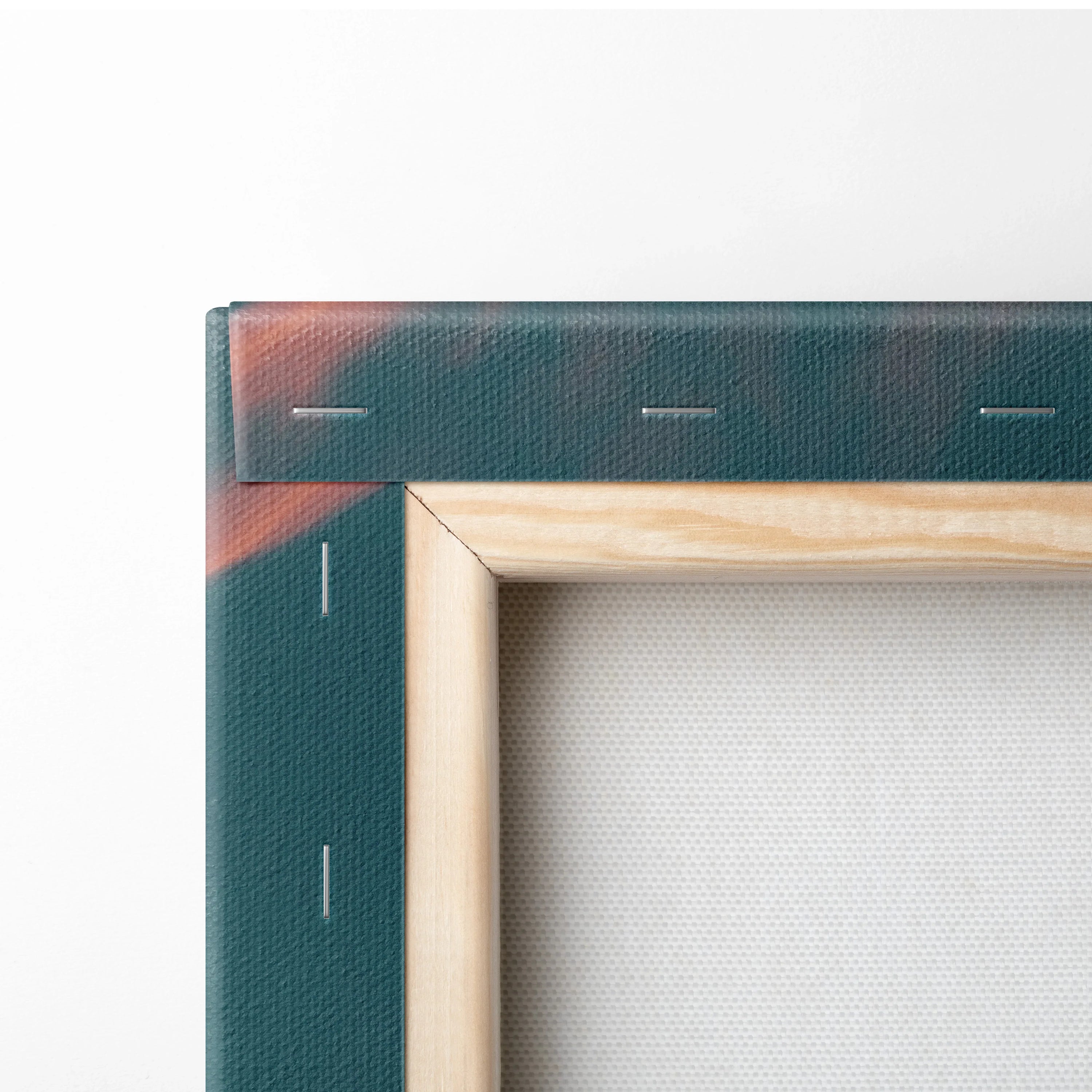 Close-up of wooden frame with stretched canvas corner showcasing wall art decor details.