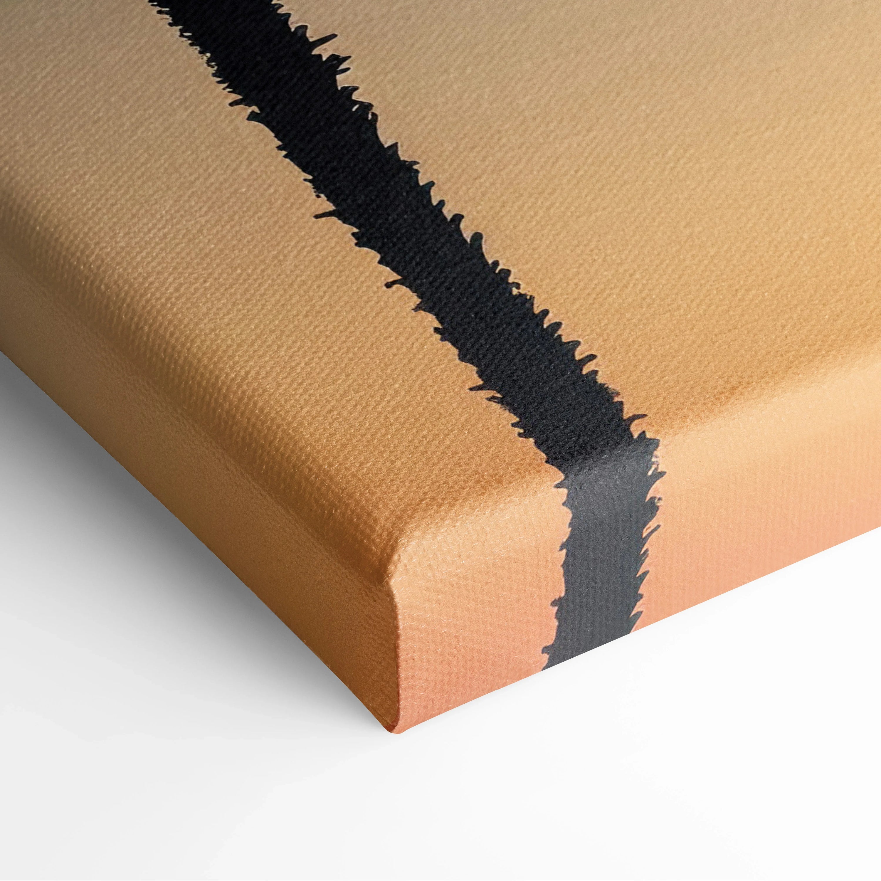 Close-up of canvas art corner with textured fabric and a bold black vertical silhouette line against a warm sunset peach.