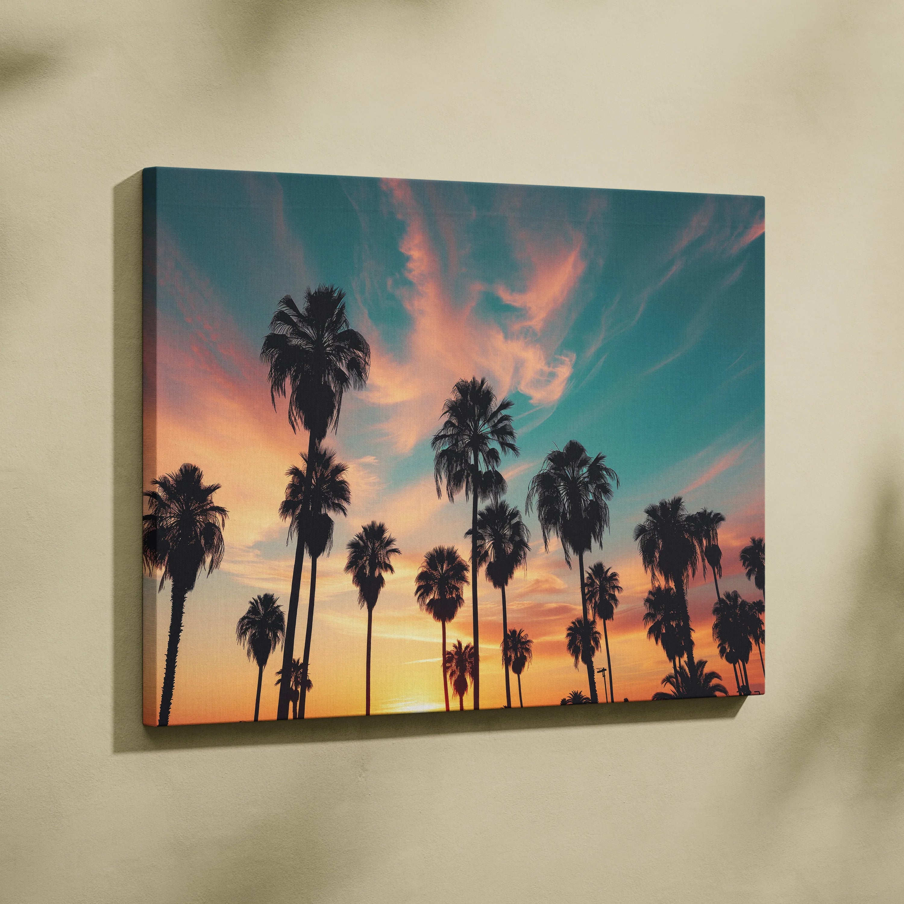 Canvas wall art featuring silhouette palm trees against a colorful sunset sky for living room decor.