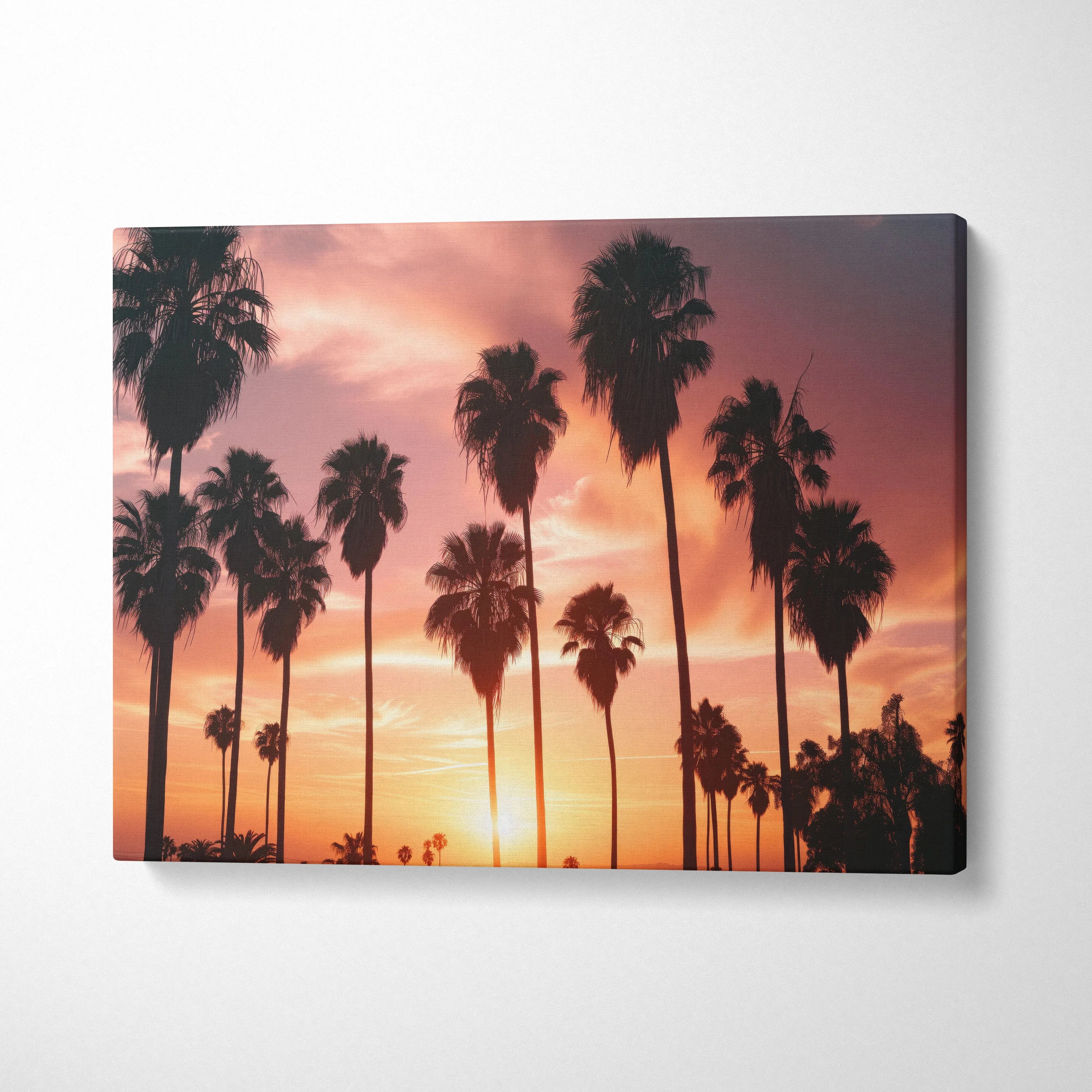 Tropical palm trees silhouette against vibrant orange and pink sunset sky canvas wall art decor.