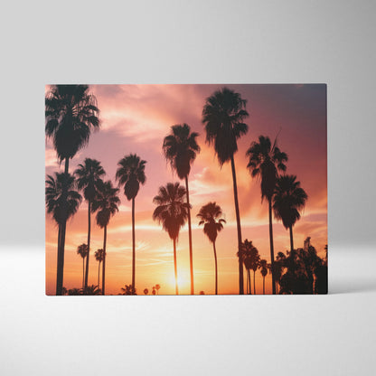 Canvas art featuring silhouetted palm trees against a vibrant tropical sunset sky with orange and purple hues.
