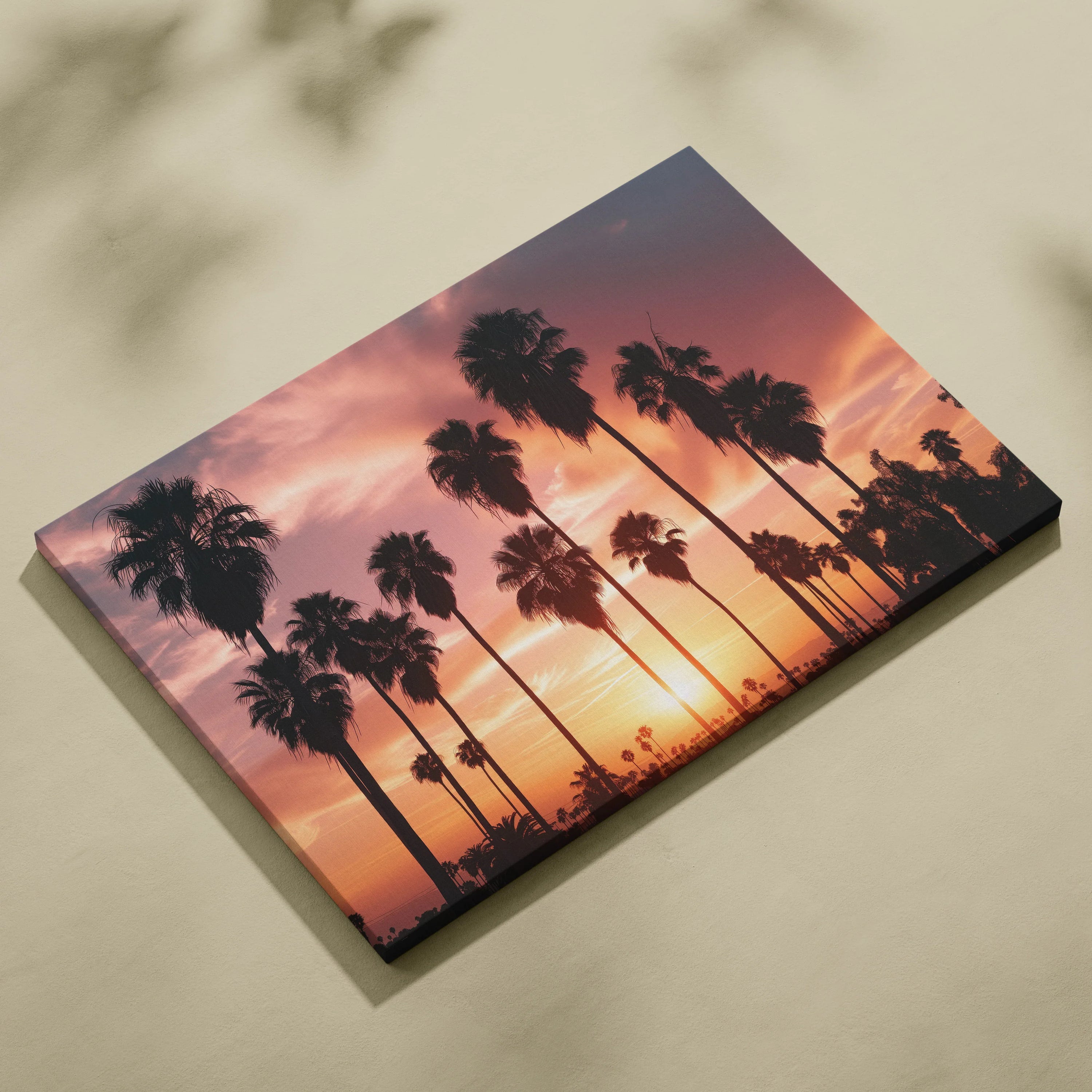 Canvas wall art featuring tall palm tree silhouettes against a vibrant orange and purple sunset sky.