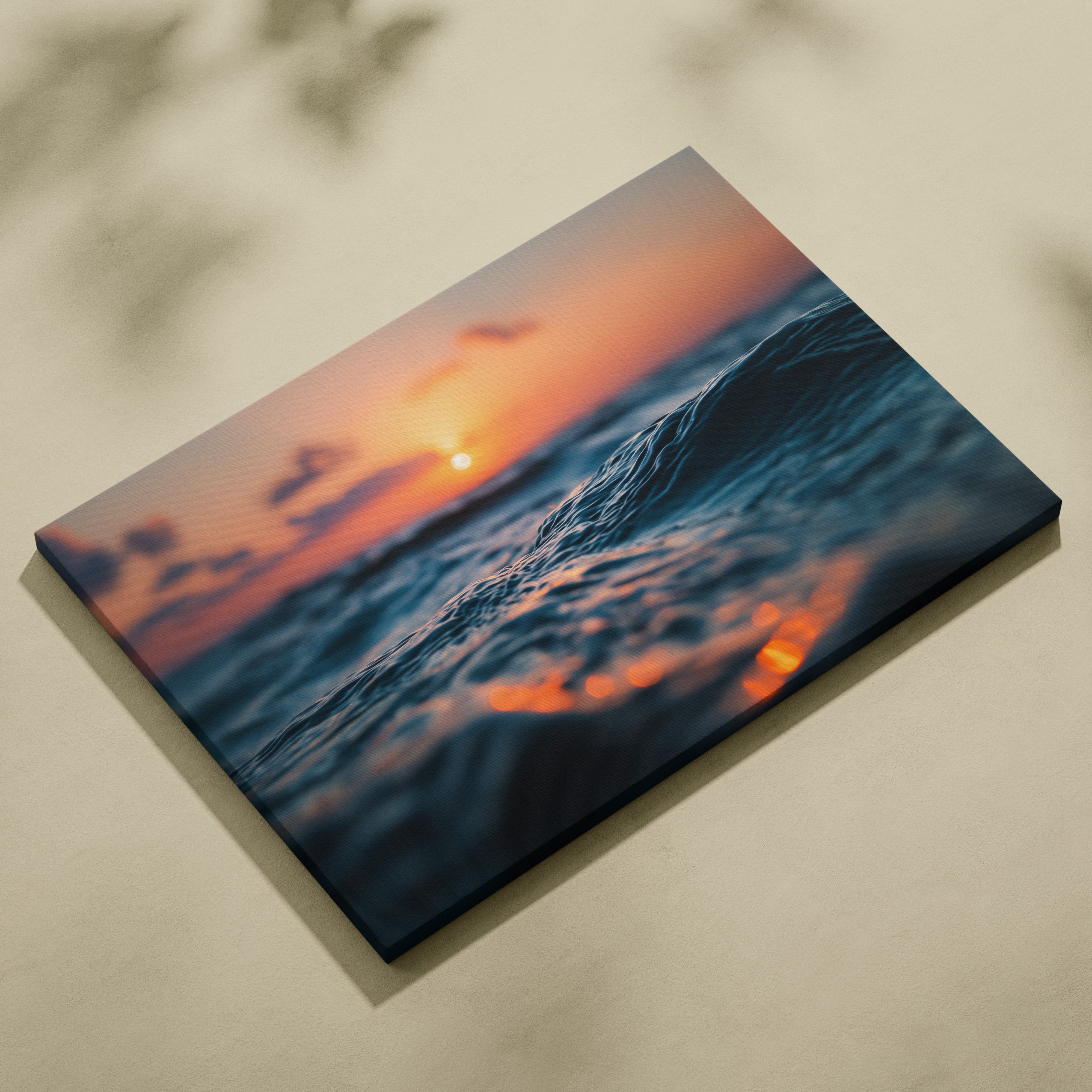 Canvas wall art featuring a golden sunset over ocean waves with warm reflections.