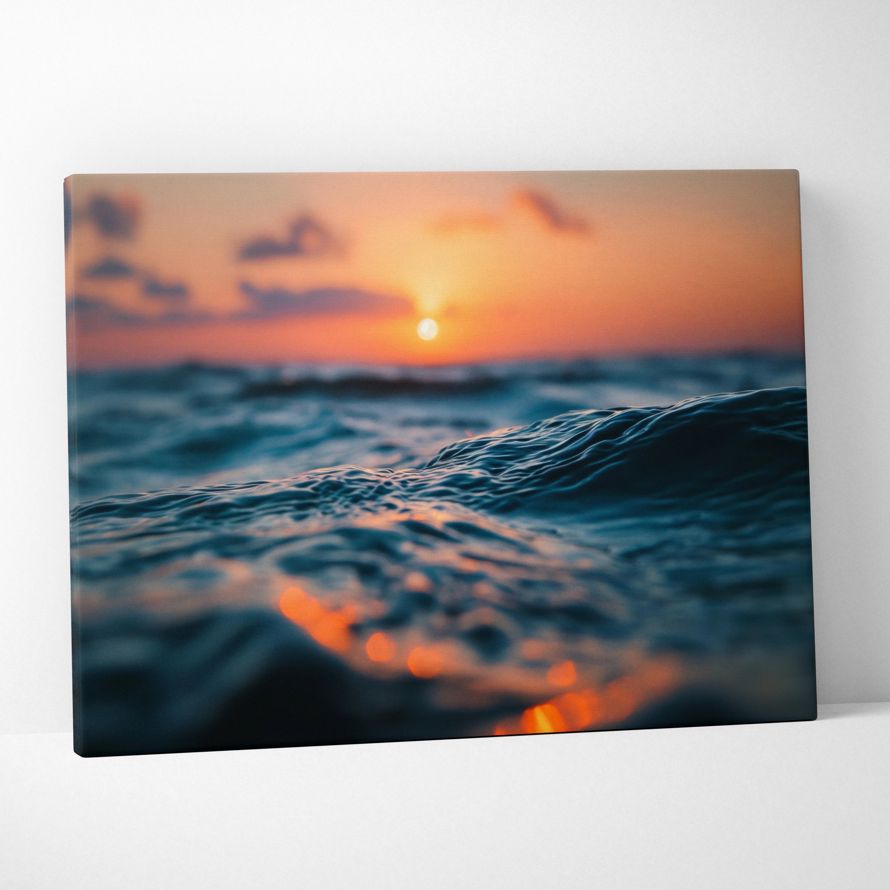 Golden sunset over ocean waves canvas wall art with warm orange and blue tones.