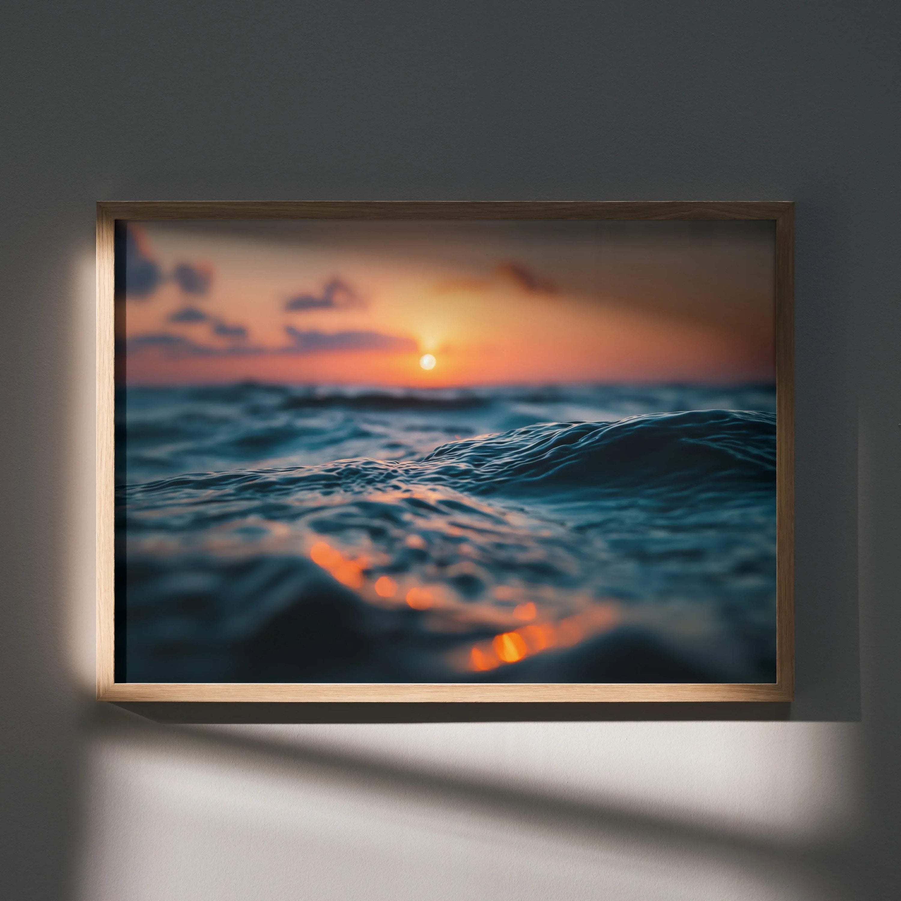 Tranquil ocean wall art poster with soft waves and warm sunset colors in wooden frame.