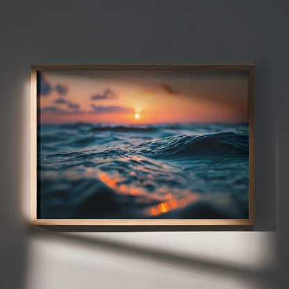 Tranquil ocean wall art poster with soft waves and warm sunset colors in wooden frame.