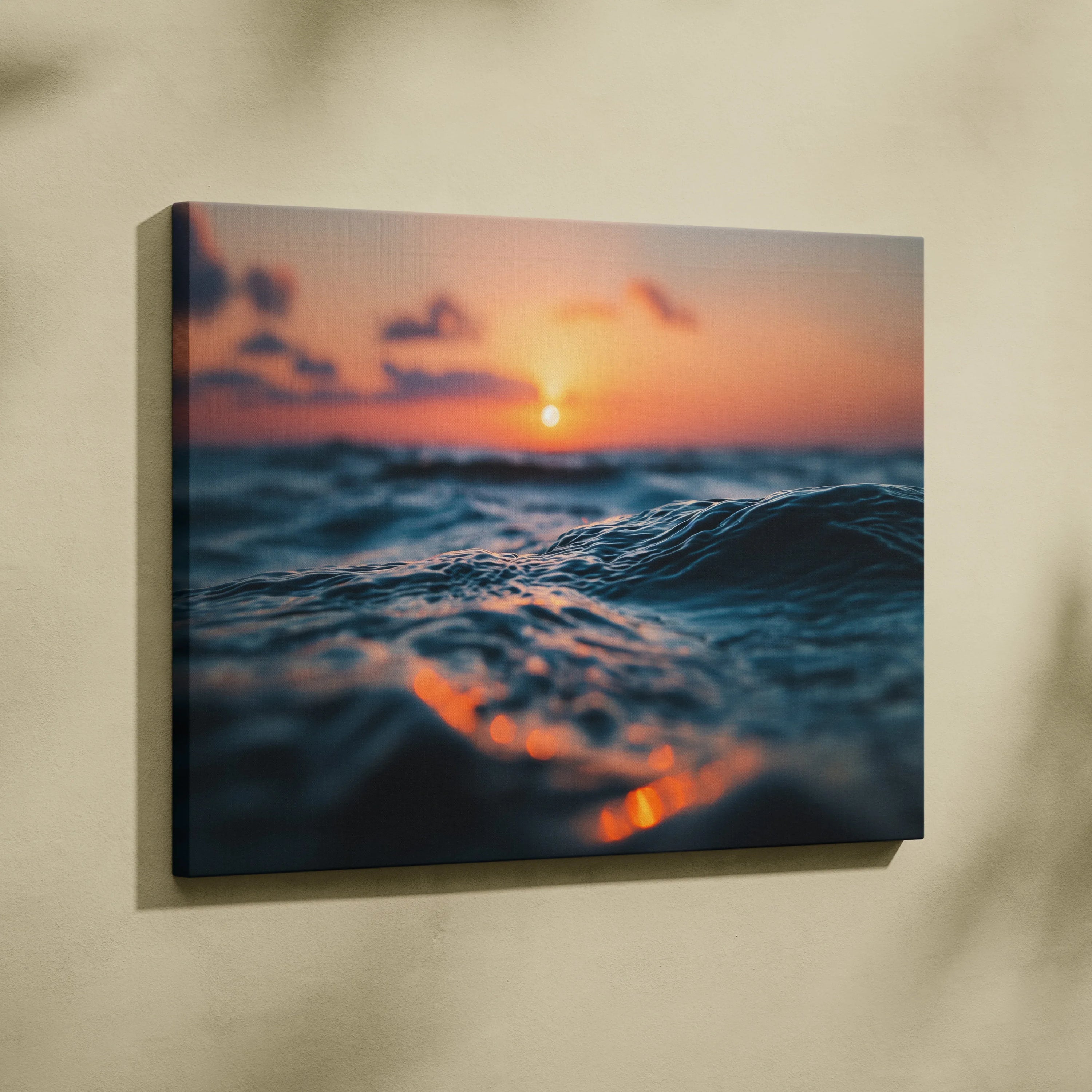 Golden sunset over ocean waves canvas wall art with vibrant orange and blue hues.