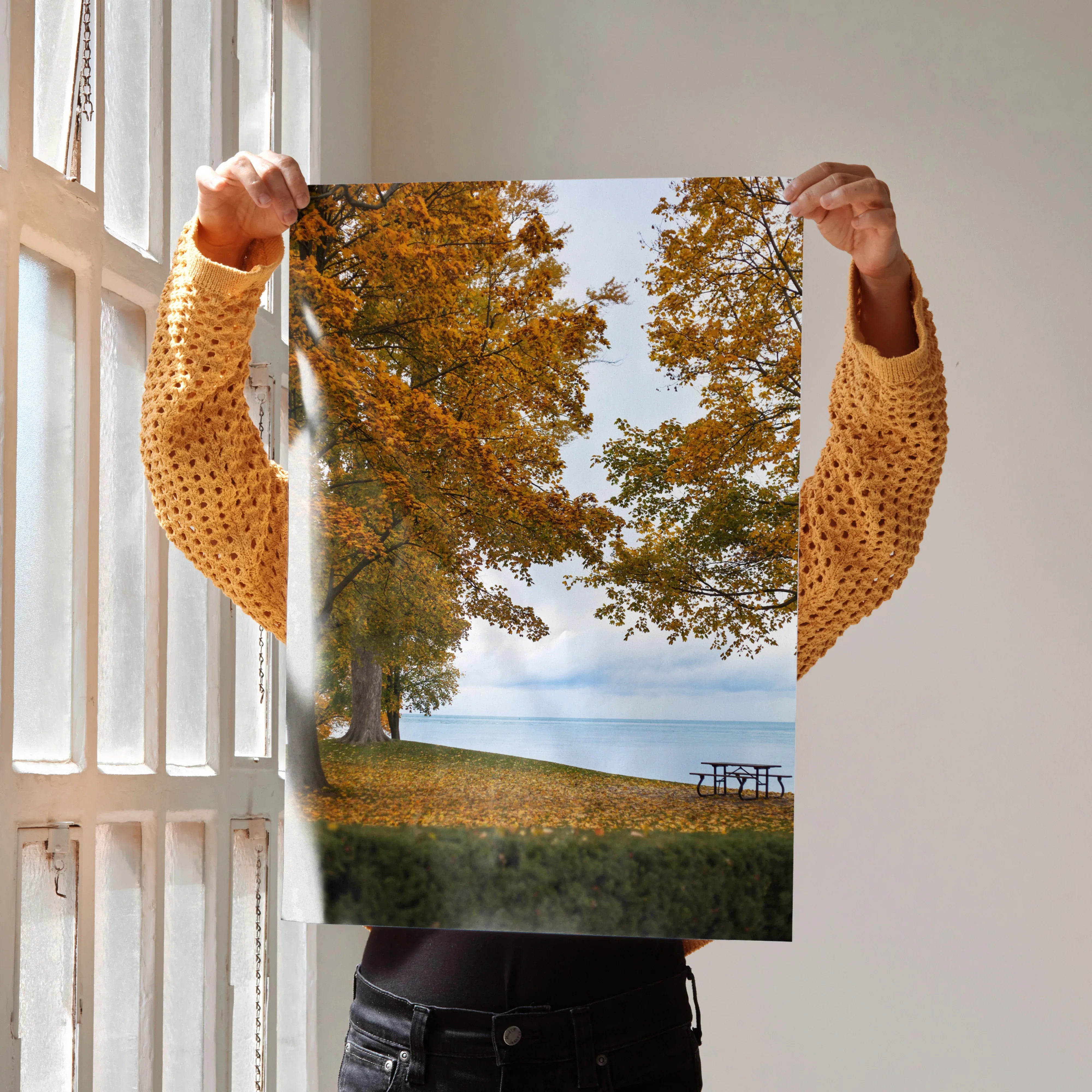 Autumn nature poster with golden leaves and trees by a lakeside, vertical wall art.