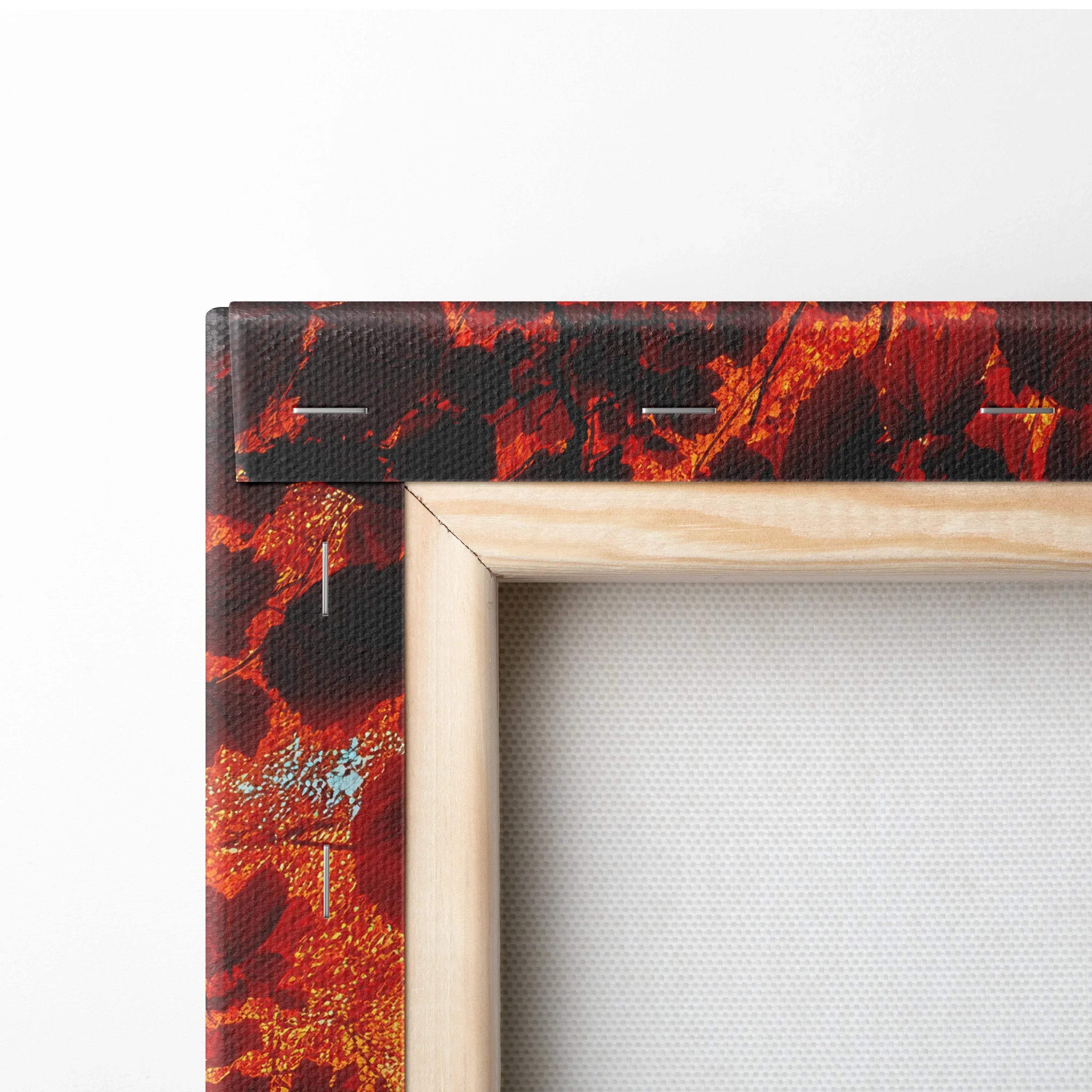 Close-up of vibrant autumn forest canvas wall art corner with wooden frame edges and textured surface.