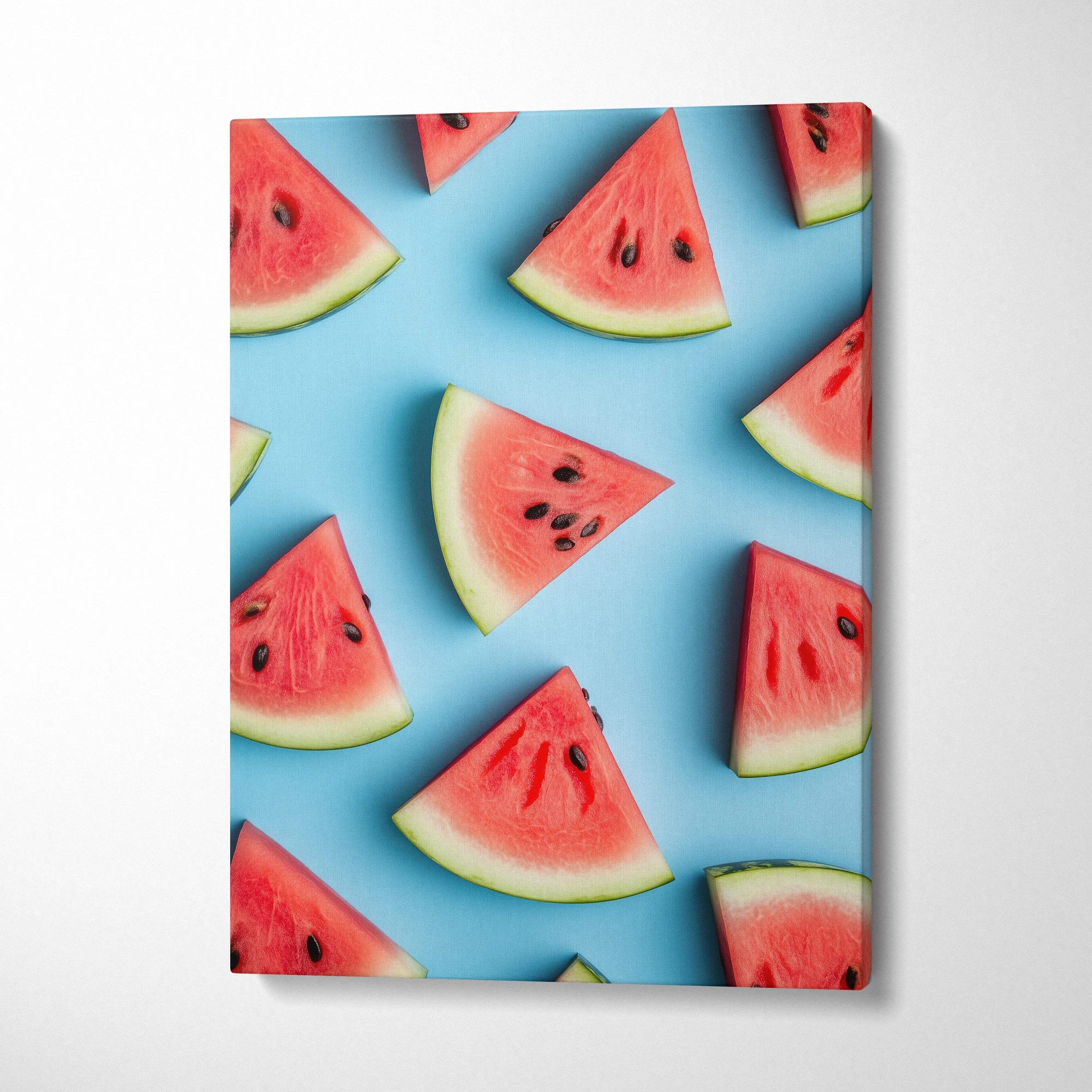 Canvas wall art featuring vibrant watermelon slices on a bright blue background.