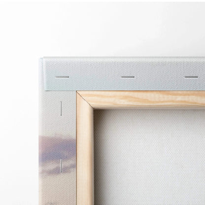 Close-up of wooden stretcher frame and canvas texture on mountain sunset wall art print.