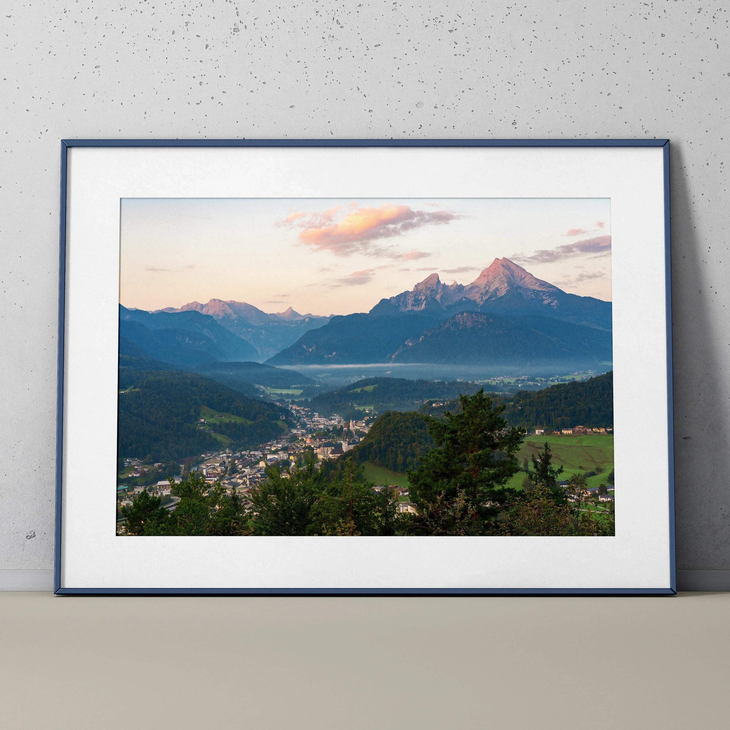 Mountain sunset scene with vibrant colors framed as wall art poster in black frame.