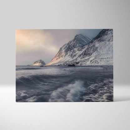 Canvas wall art featuring snowy mountain peaks and turbulent ocean waves under a cloudy sky.