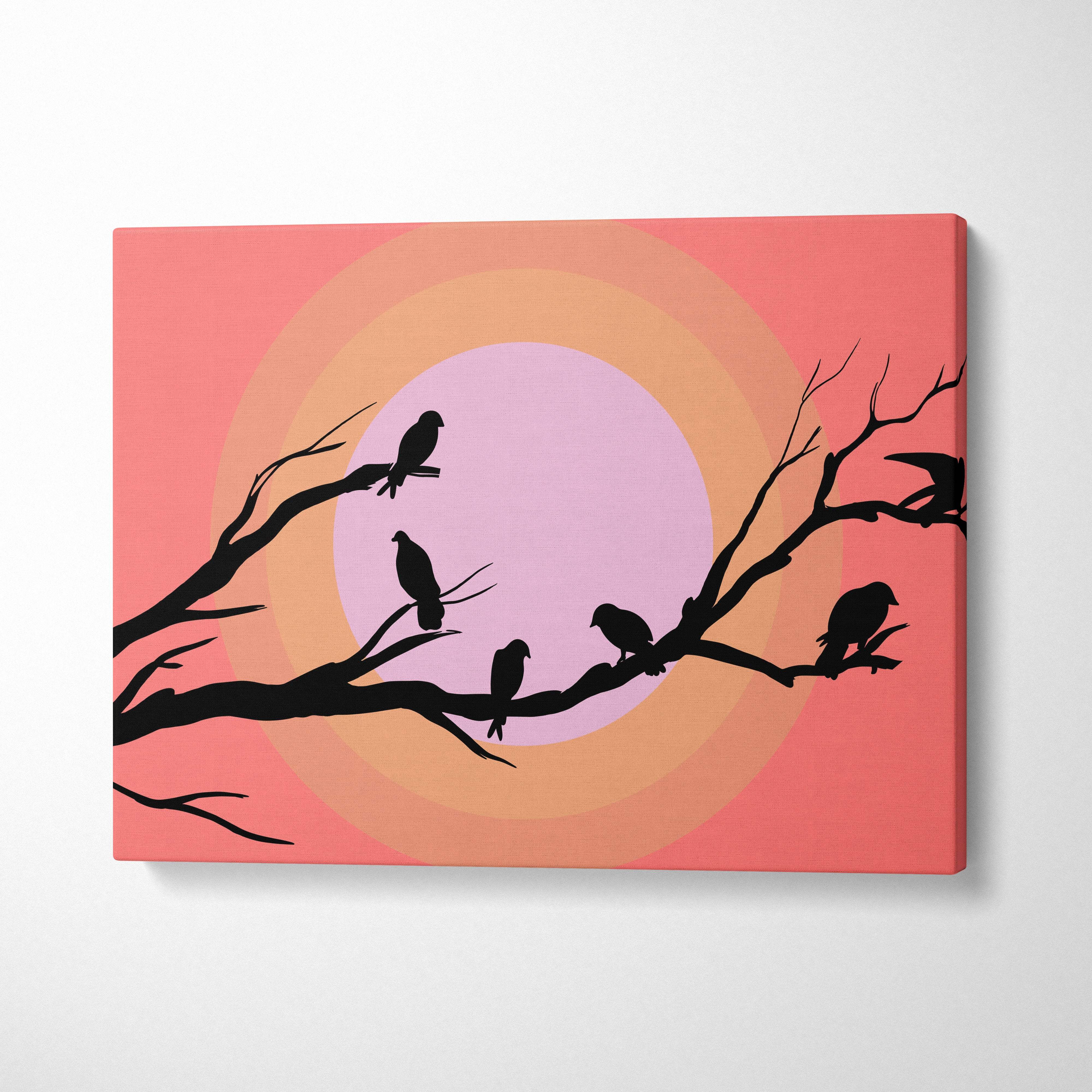 Rectangular canvas print of black bird silhouettes on bare branches against a coral and pastel sunset gradient background