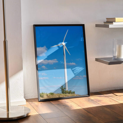 Captivating windmill rural landscape art print with blue sky and clouds, vertical wall art poster in black frame.