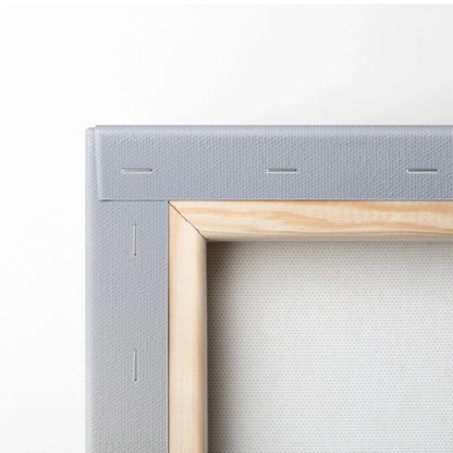 Close-up of wooden canvas frame and white stretched fabric for wall art print.