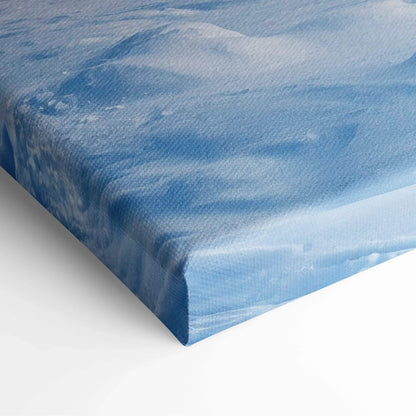 Blue canvas print of photorealistic snowy pine forest sunrise with watercolor sky