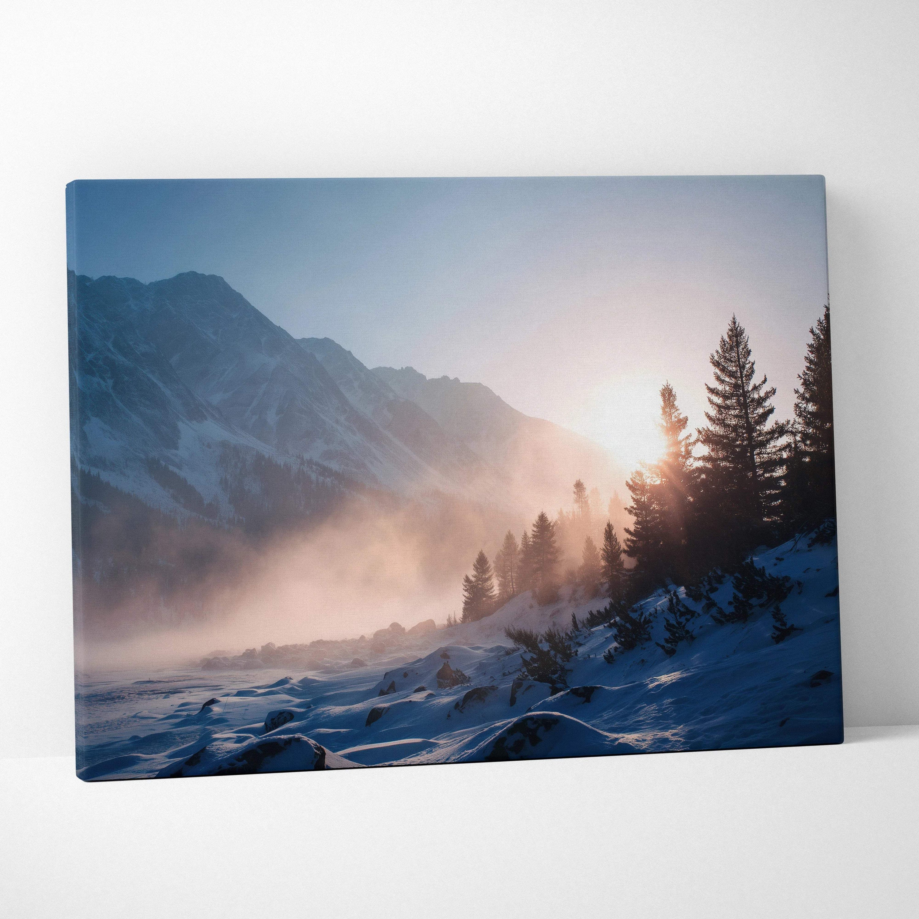 Serene winter sunrise over snowy mountains and pine forest canvas print