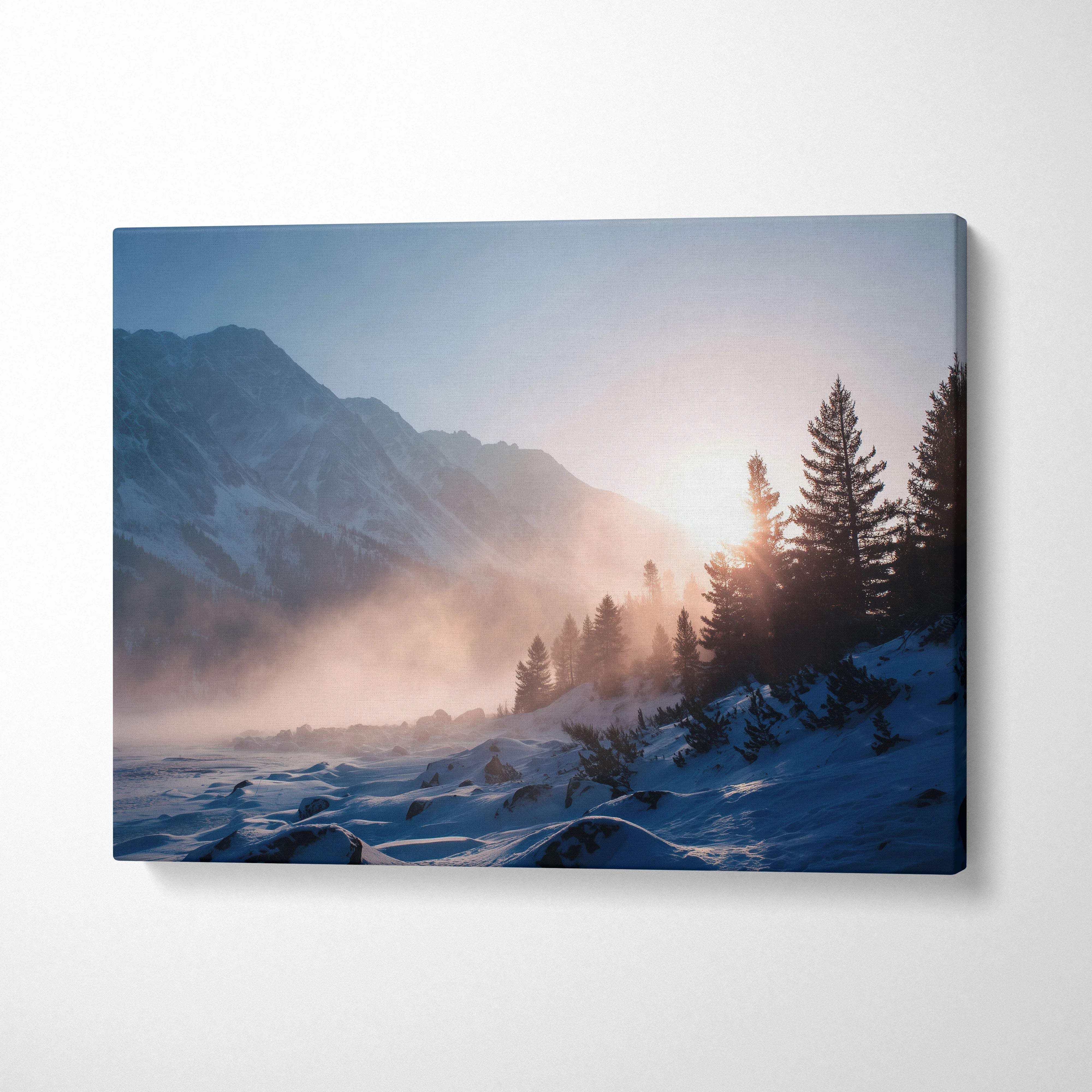 Serene winter sunrise over snowy mountains and pine forest canvas print