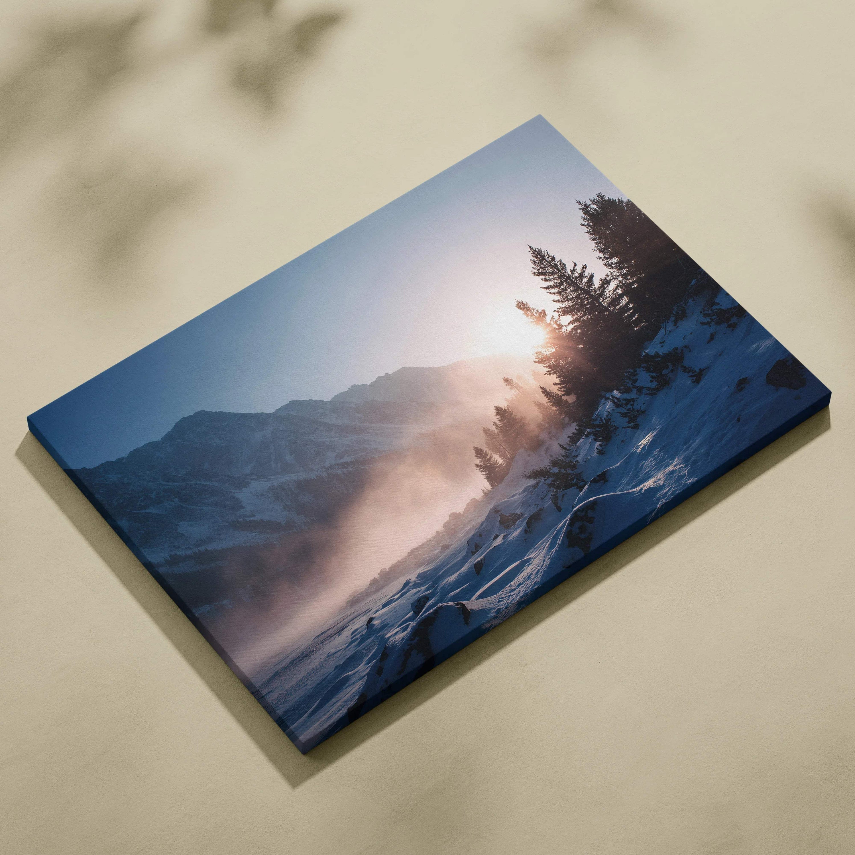 Blue canvas print of serene winter sunrise over snowy mountains and pine forest