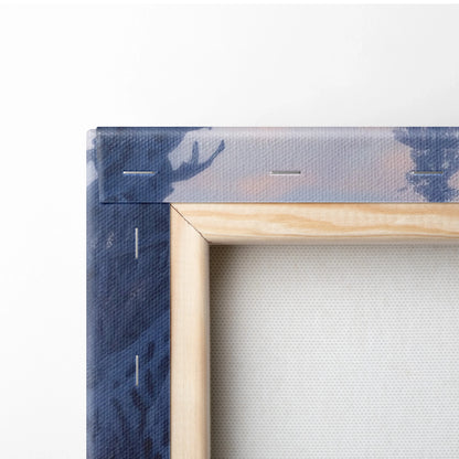 Close-up of corner on wooden frame stretched with snowy winter landscape canvas art featuring soft blue and purple hues.