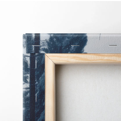 Close-up of wooden frame and stretched canvas showing snowy river and dark blue forest scene on winter landscape wall art.