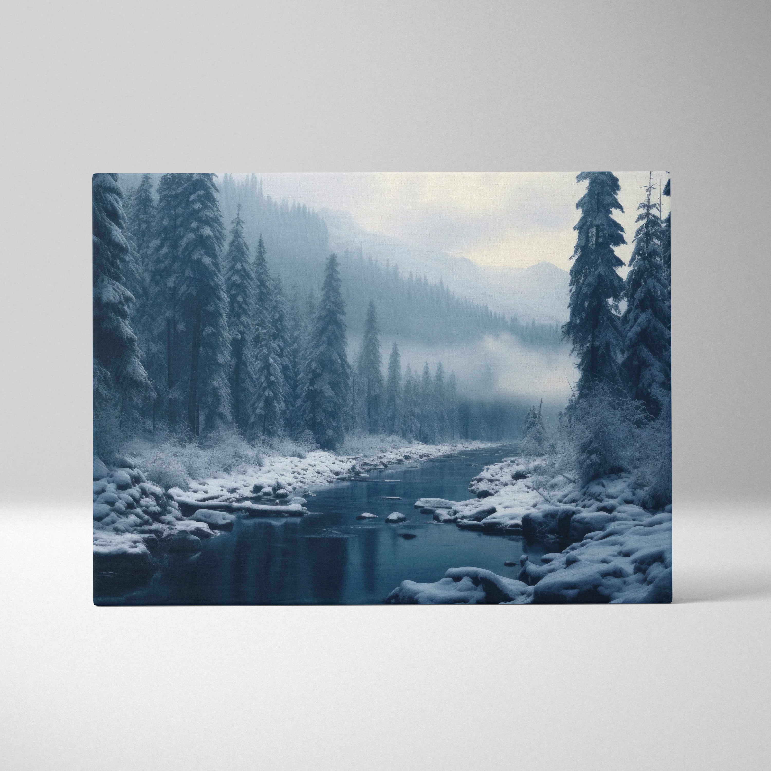 Canvas wall art featuring a snowy river flowing through a misty blue-toned forest winter landscape.