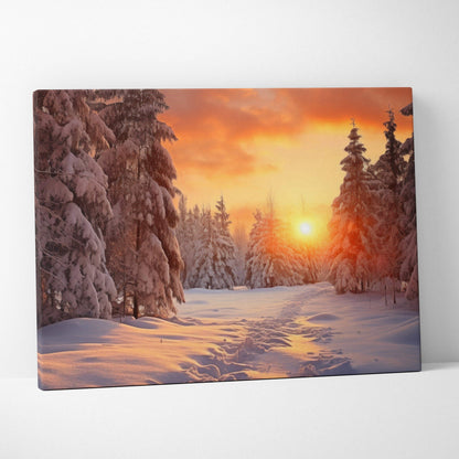 Canvas art print featuring a vivid snowy forest landscape at sunset with warm orange and yellow sky tones.