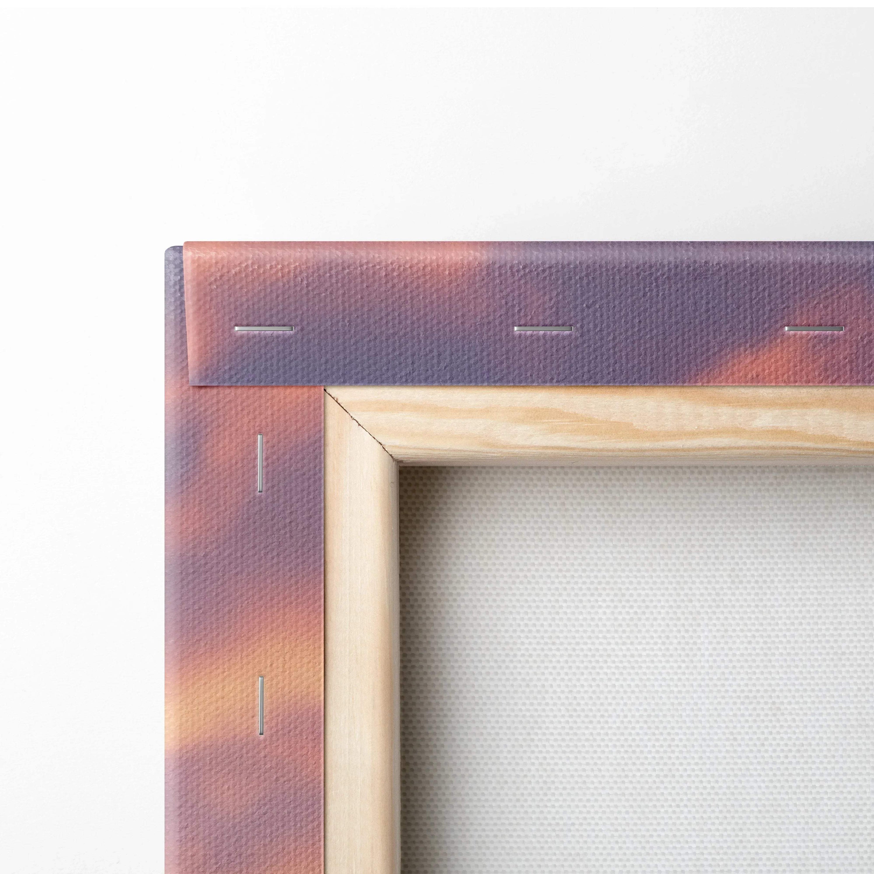 Corner view of wood-framed canvas wall art with snowy sunset colors in purple and orange tones.
