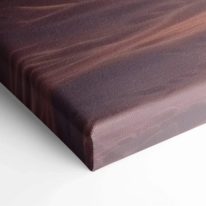 Close-up of textured canvas wall art with soft, muted brown and pink tones blending in a dreamy, abstract sunset design.