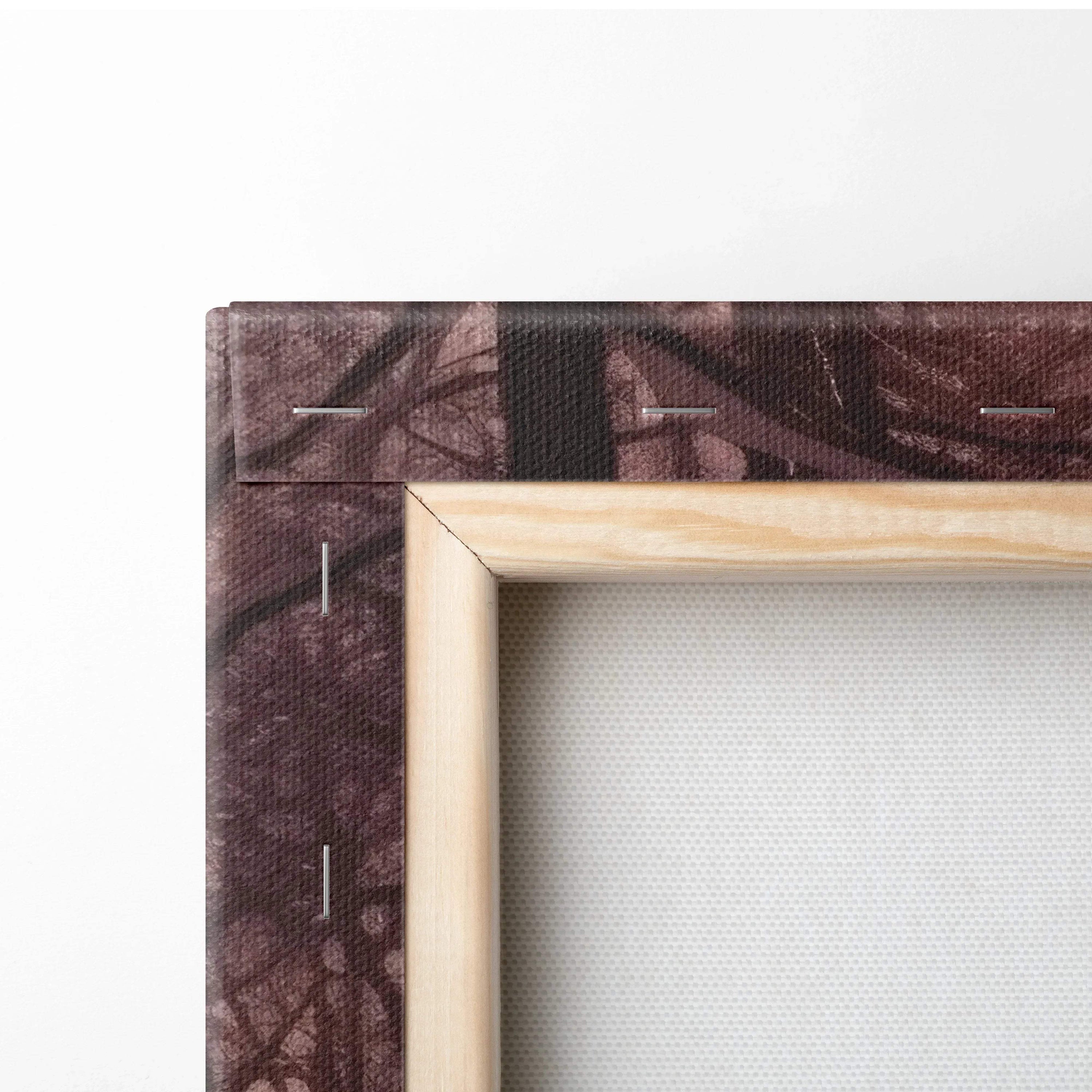 Close-up of stretched canvas wall art with wooden frame and snowy, dark purple abstract nature design.