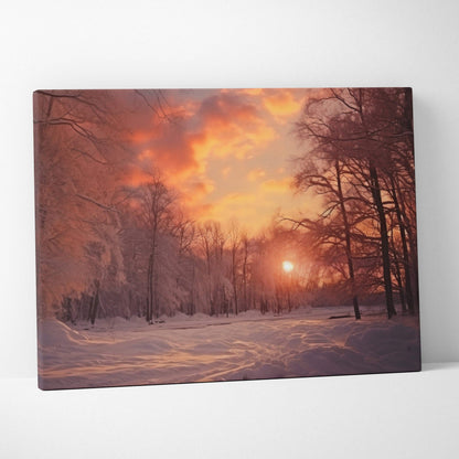 Canvas wall art featuring a snowy winter landscape with bare trees and a warm orange sunset sky for home decor.