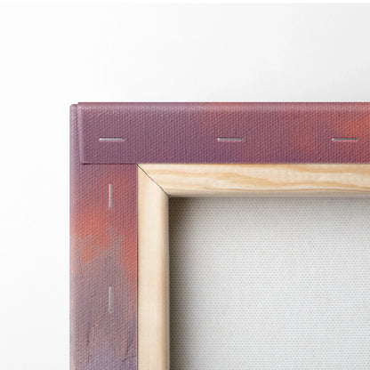 Close-up of a wooden frame canvas with stapled purple and orange painted fabric, showing texture and craftsmanship.