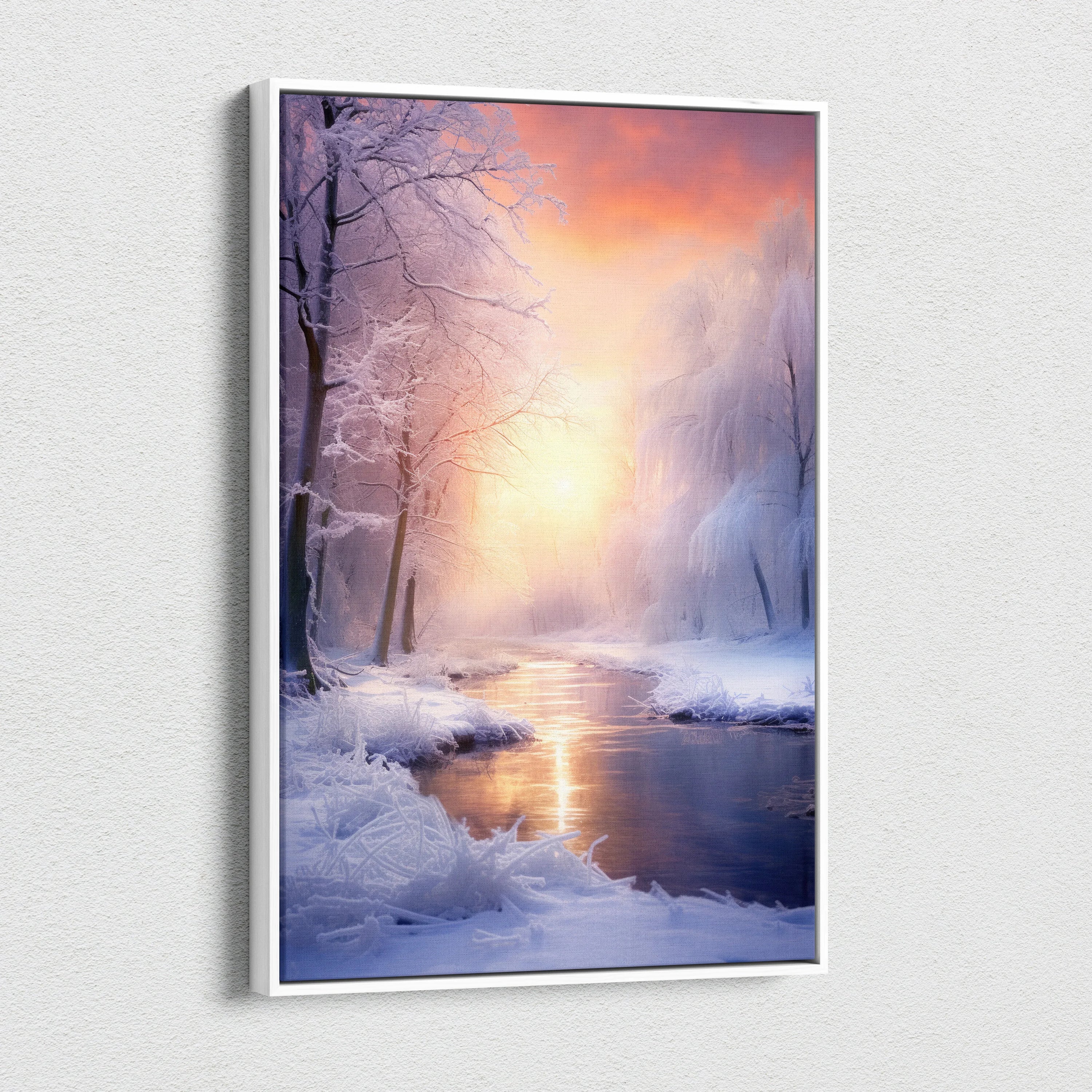 Canvas wall art depicting a snowy winter landscape with a glowing orange and pink sunset over a calm river.