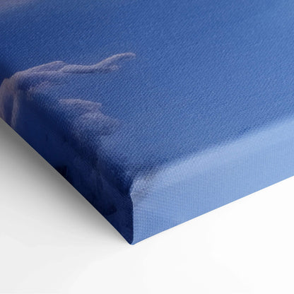 Blue canvas print with textured surface featuring a soft snowy sunset landscape design.
