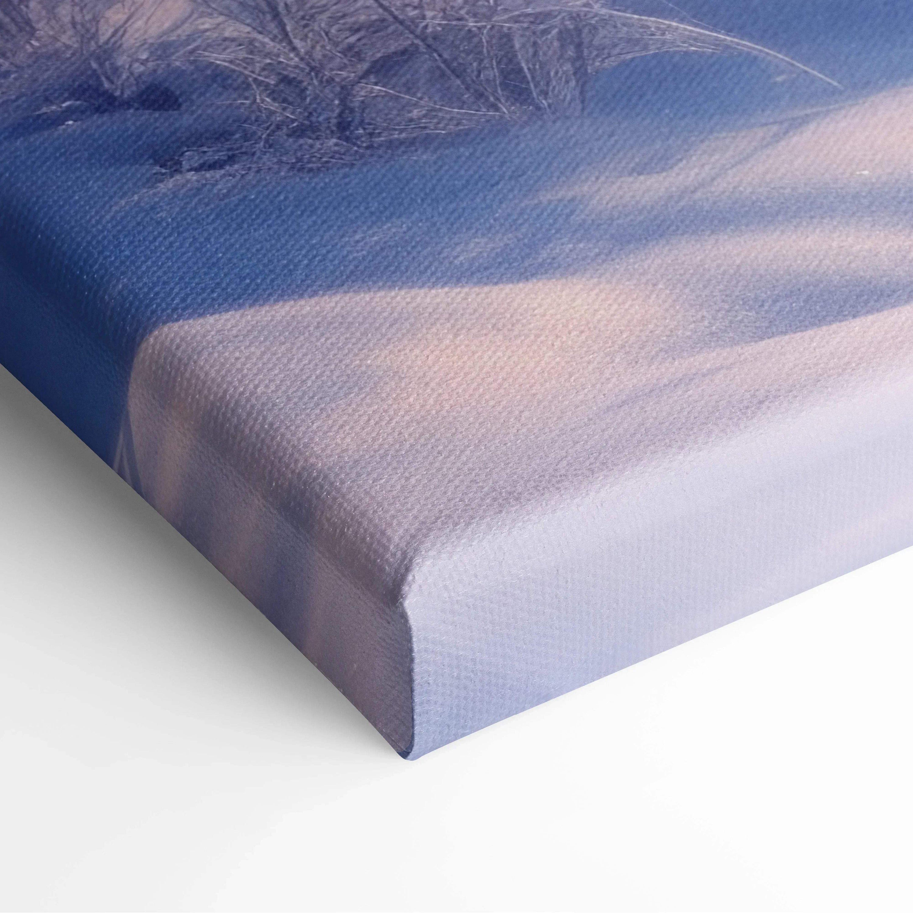 Winter snowy sunset landscape printed on wrapped canvas wall art with soft purple and blue tones for home decor.