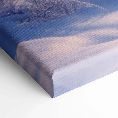 Winter snowy sunset landscape printed on wrapped canvas wall art with soft purple and blue tones for home decor.