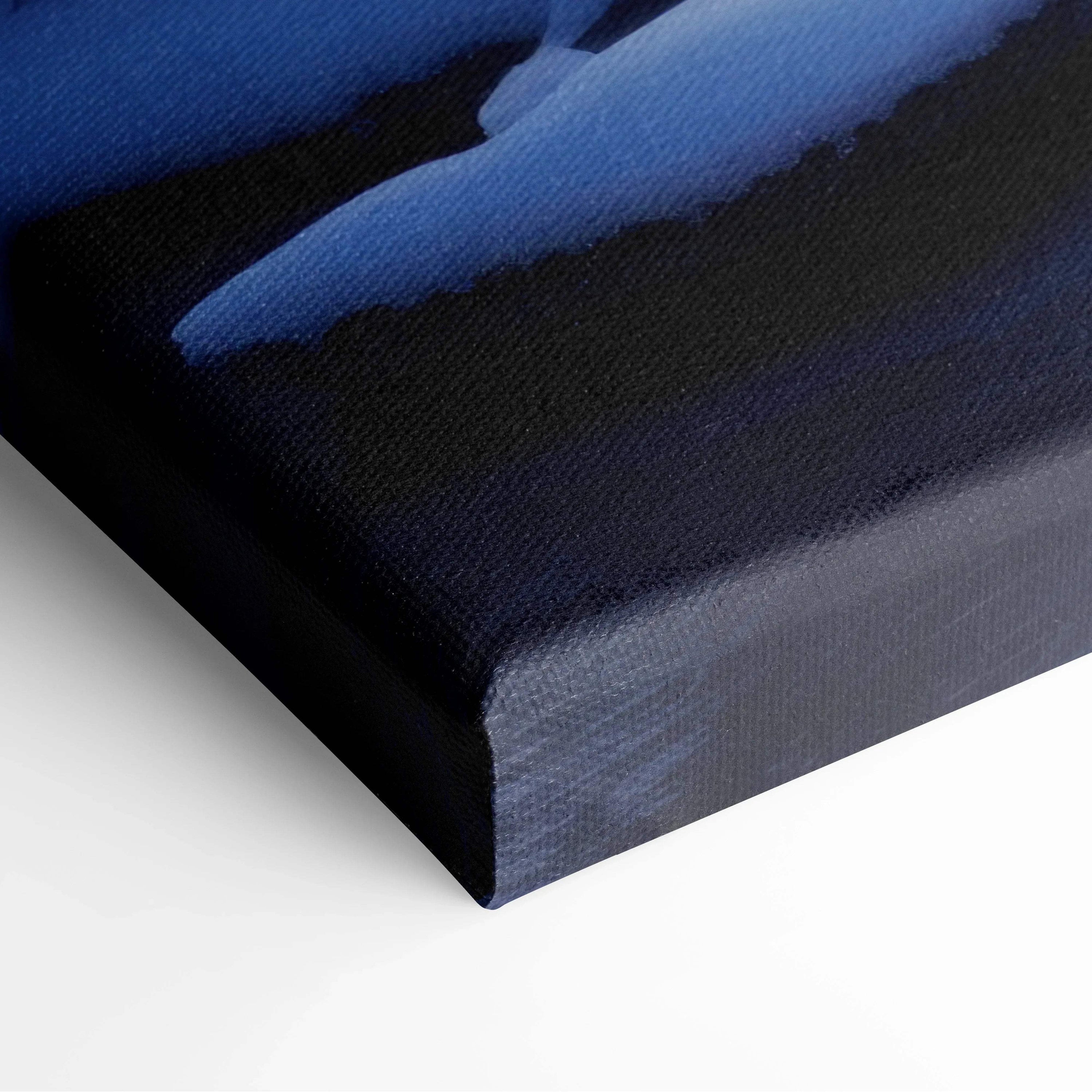 Canvas wall art featuring a dark blue and black abstract snowy river scene with soft gradient sunset hues.